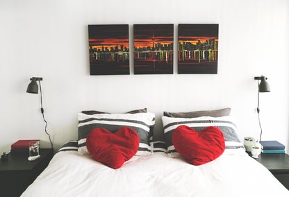 Bed in modern condo with artwork